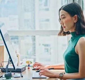 Woman working at desk high-rise office