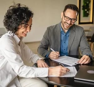 Two men reviewing document together